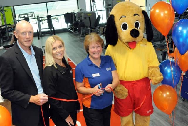 Alfreton Leisure Centre's new gym is officially opened on Friday by their Fitness Operations manager Barbara Bexton, second right, assisted by centre mascot, Hector the Hound, Contract manager Peter Sharkey and Health and Wellbeing manager - Amber Valley Contract, Maxine Start.