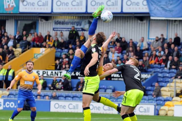 Mansfield Town v Cambridge United.Danny Rose goes for the spectacular during the first half.