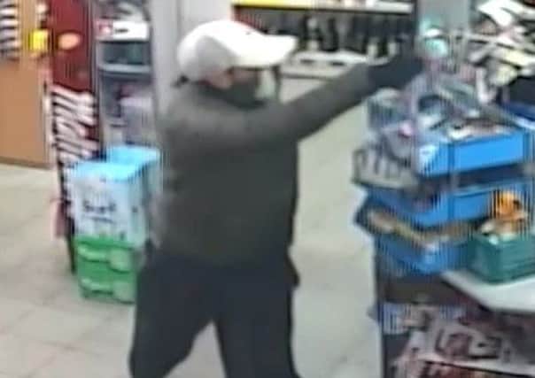 Officers are trying to identify this man following an attempted robbery at a convenience store in Ashfield.