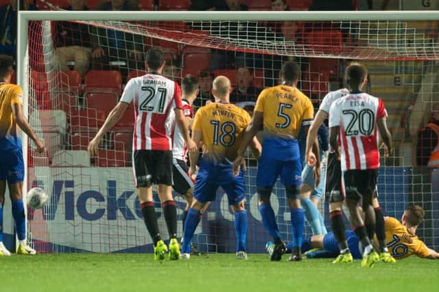 Cheltenham Town v Mansfield Town - Cheltenham nearly grab the lead but their chance bounces off the post - Pic By James Williamson