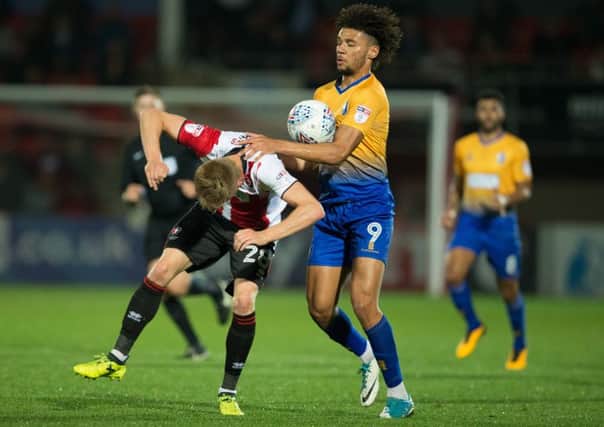 Cheltenham Town v Mansfield Town - Lee Angol of Mansfield Town battles with Taylor Moore of Cheltenham Town - Pic By James Williamson