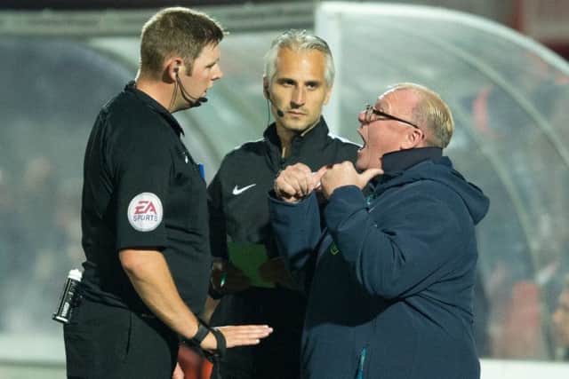 Cheltenham Town v Mansfield Town - Steve Evans argues with referee Brett Huxtable - Pic By James Williamson