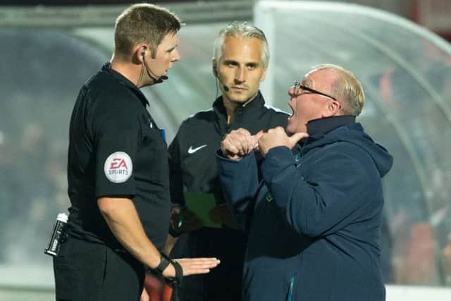 Cheltenham Town v Mansfield Town - Steve Evans argues with referee Brett Huxtable - Pic By James Williamson