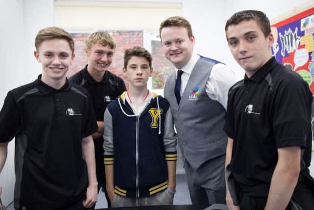 Snooker champion Shaun Murphy with R.E.A.L. Education students at a charity event last year.