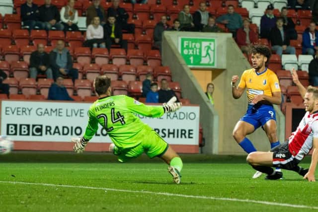 Lee Angol of Mansfield Town sends a shot just wide - Pic By James Williamson