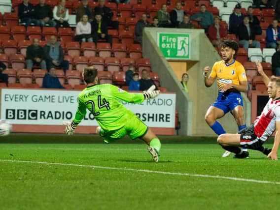 Lee Angol of Mansfield Town sends a shot just wide - Pic By James Williamson