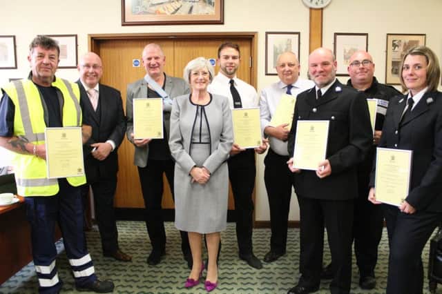 Street cleaner Gary Varnam, left, PC Ian Dickson, third from right, neighbourhood warden Tony Bower, second from right, and PC Amy Whitehouse, right, were among those honoured by Kate Allsop, Mansfield mayor, centre.