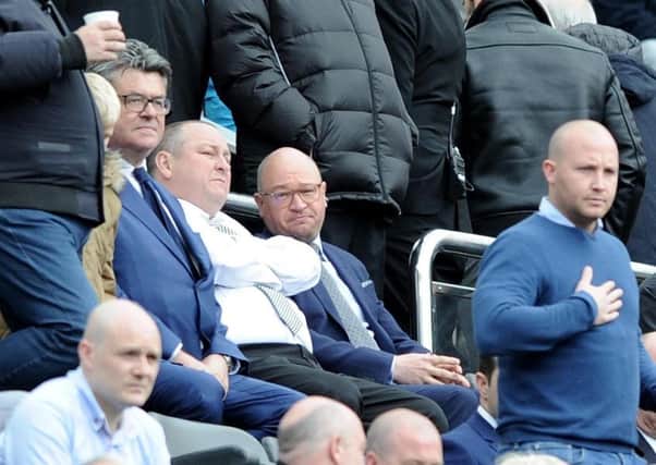 Mike Ashley (centre), whose Newcastle United could soon be the subject of a takeover approach by a Dubai-based equity firm, according to today's rumour mill.