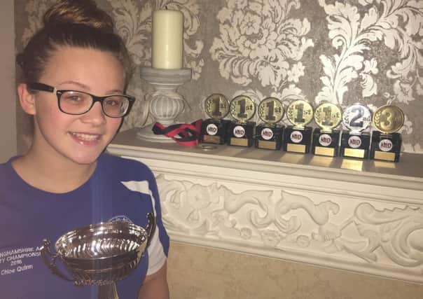 Chloe Quinn with all her trophies from the Matlock Open Meet.