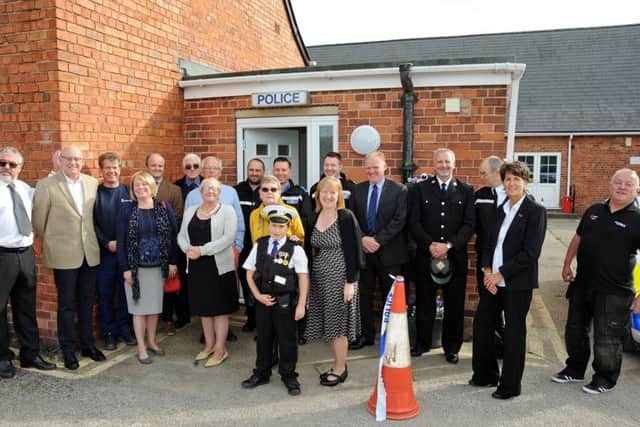 Community members gather outside their new Police contact point in Selston after it's official opening on Tuesday.
