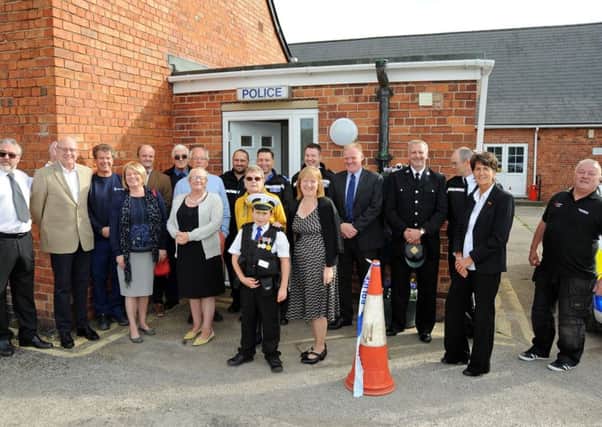 Community members gather outside their new Police contact point in Selston after it's official opening on Tuesday.