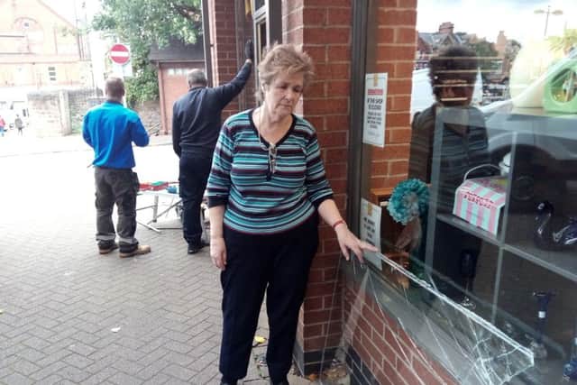 Volunteer Jane Phillips surveys the damage after thieves broke into the Air Ambulance Shop in Sutton for the eight time.