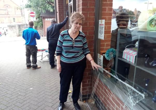 Volunteer Jane Phillips surveys the damage after thieves broke into the Air Ambulance Shop in Sutton for the eight time.