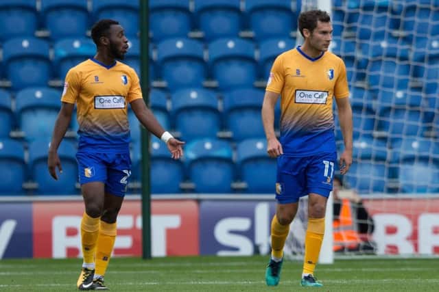 Colchester United vs Mansfield Town - Omari Sterling-James and Will Atkinson of Mansfield Town after Colchester take the lead - Pic By James Williamson