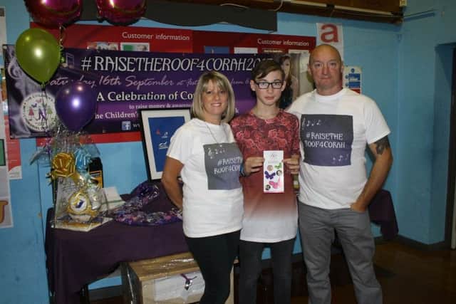 RaiseTheRoof4Corah 2017 at Kirkby Festival Hall: Lisa and Carl Slaney with singer Carlton.