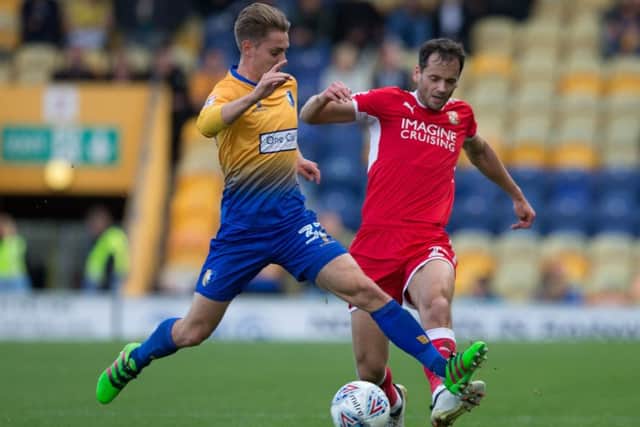 Mansfield Town vs Swindon Town - Danny Rose of Mansfield Town battles with Ben Purkiss of Swindon Town - Pic By James Williamson