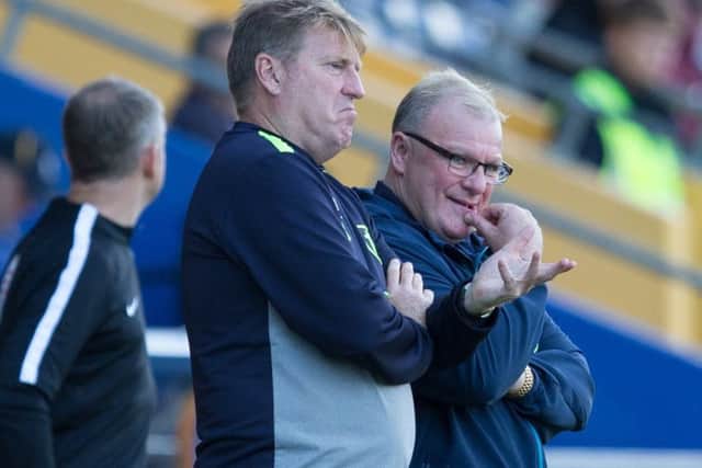 Mansfield Town vs Swindon Town - Paul Raynor and Steve Evans left looking for Answers against Swindon - Pic By James Williamson