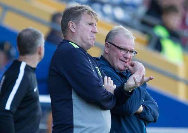 Mansfield Town vs Swindon Town - Paul Raynor and Steve Evans left looking for Answers against Swindon - Pic By James Williamson