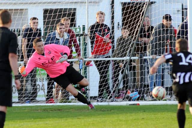 Goalkeeper Jason White caps a great day for AFC Mansfield by saving a late penalty from Clipstone's Gareth Curtis. (PHOTO BY: Anne Shelley)