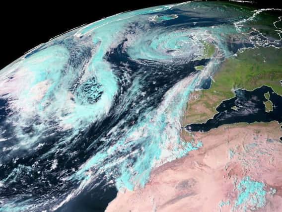 Satellite imagery shows Ophelia's path over the UK.