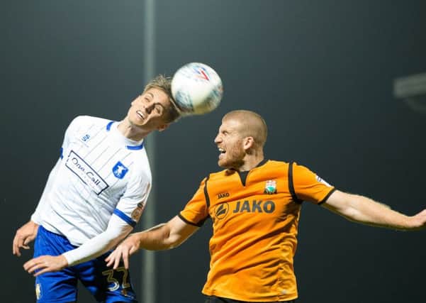 Barnet vs Mansfield Town - Danny Rose of Mansfield Town battles in the air with Charlie Clough of Barnet - Pic By James Williamson