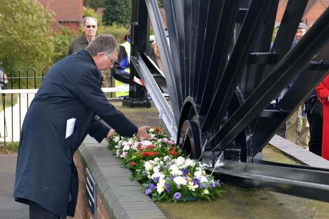 Mineworkers memorial service at the site of the Sherwood Colliery Pit Wheel, Coun Alan Rhodes lays a wreath for Nottinghamshire County Council