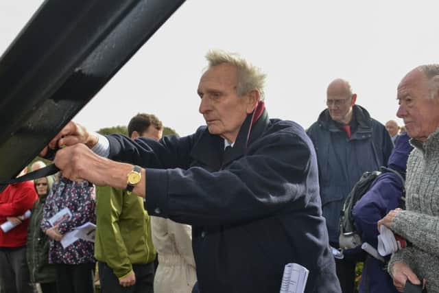 Mineworkers memorial service at the site of the Sherwood Colliery Pit Wheel, tying black ribbons on the Colliery wheel in remembrance