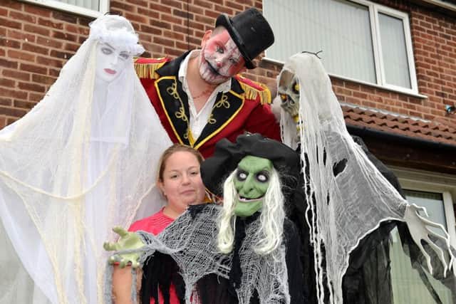 The Marriott Family are creating a haunted house for Halloween with all donations to A Dollar For Dawson, pictured is stilt walker Ryan Bowskill of Party Generators with Kirsty Marriott