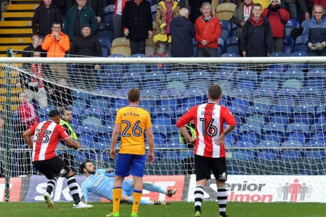 Exeter's Reuben Reid the last-minute penalty to take all 3 points at Mansfield Town last season.
