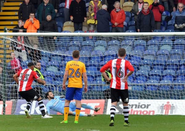 Exeter's Reuben Reid the last-minute penalty to take all 3 points at Mansfield Town last season.