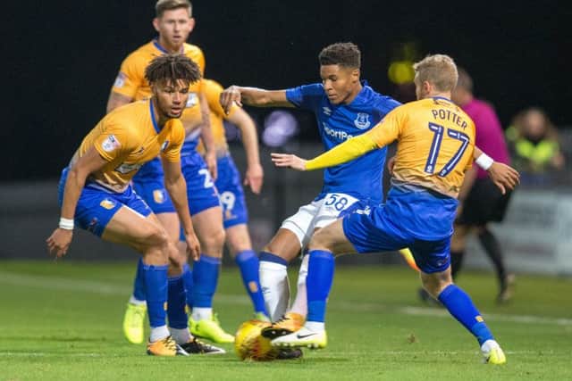 Mansfield Town vs Everton U23 - Lee Angol and Alfie Potter battle for the ball - Pic By James Williamson