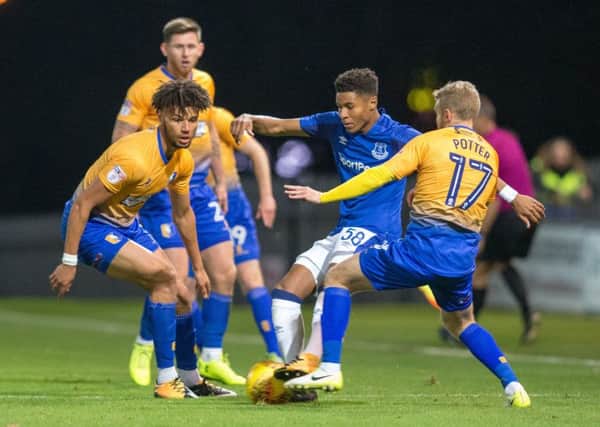 Mansfield Town vs Everton U23 - Lee Angol and Alfie Potter battle for the ball - Pic By James Williamson