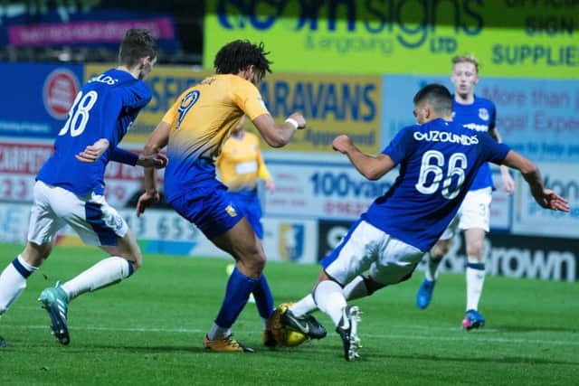 Mansfield Town vs Everton U23 - Lee Angol has a shot blocked - Pic By James Williamson