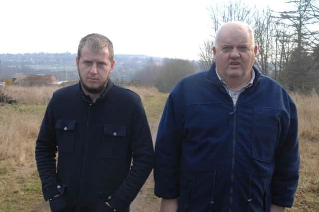 Hopeful travellers' site developers, Aaron Smith (right) and son Benjamin on the plot of land off Churchfield Drive, Rainworth.