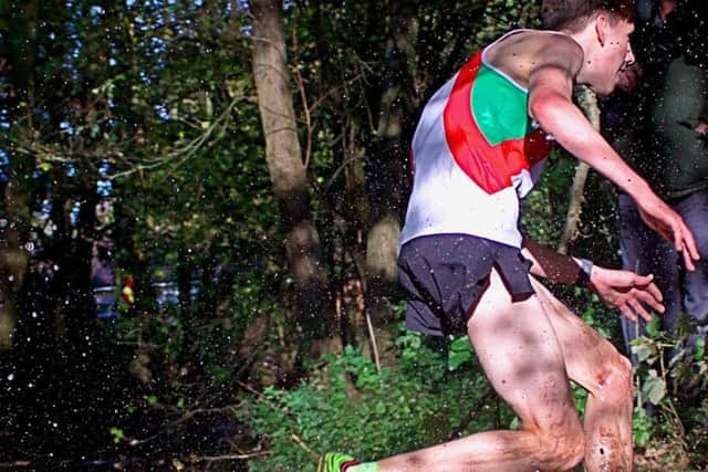 Sam Moakes, of Sutton Harriers, on his way to an excellent eighth place in the Booths Decorators Cross-Country League.