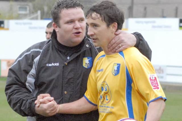 Paul Holland, left, pictured woth former Stags player Michael Boulding.