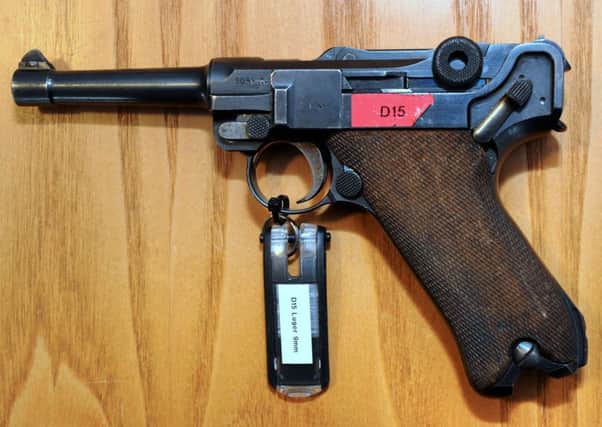 A German Lugar handgun handed in to the police under the current firearm surrender scheme.