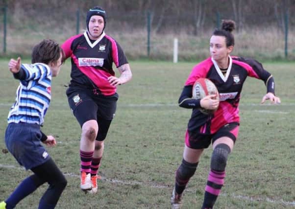 On the run against Halifax Ladies is Vicky Fegan (right), the scorer of two tries for Ashfield Ladies.