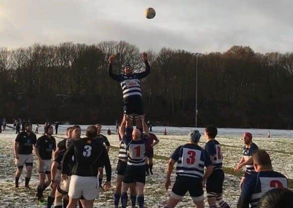 High-flying action from Mansfields narrow 23-21 victory over Kesteven at snowy Eakring Road.