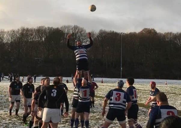 High-flying action from Mansfields narrow 23-21 victory over Kesteven at snowy Eakring Road.