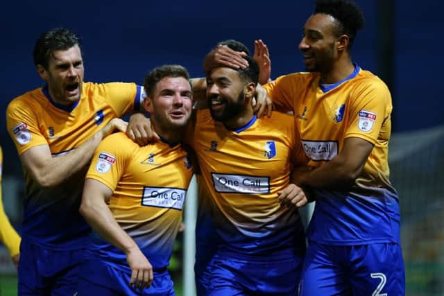 Kane Hemmings of Mansfield Town celebrates his second goal for Mansfield with team mates unknowing the goal was disallowed during the Sky Bet League 2 match between Mansfield Town and Stevenage at the One Call Stadium, Mansfield, England on 18 November 2017. Photo by Leila Coker / PRiME Media Images.