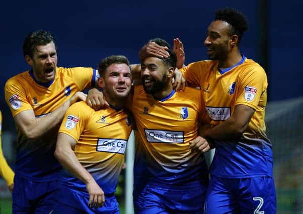 Kane Hemmings of Mansfield Town celebrates his second goal for Mansfield with team mates unknowing the goal was disallowed during the Sky Bet League 2 match between Mansfield Town and Stevenage at the One Call Stadium, Mansfield, England on 18 November 2017. Photo by Leila Coker / PRiME Media Images.