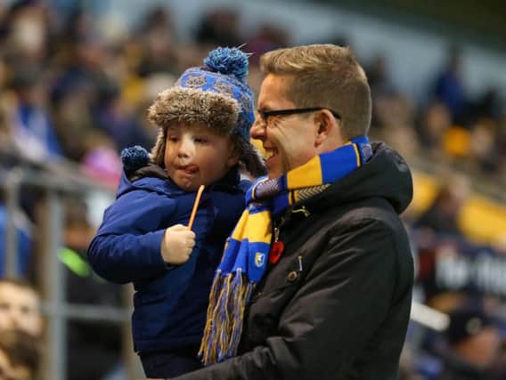 A Mansfield Town fan and his son before the game.