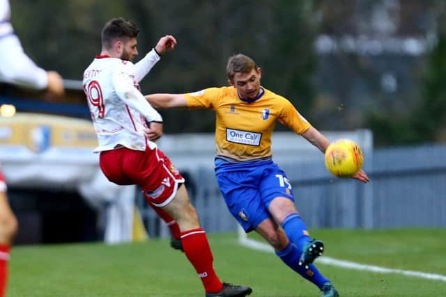 James Spencer of Mansfield Town clears the ball against Danny Newton of Stevenage during the Sky Bet League 2 match between Mansfield Town and Stevenage at the One Call Stadium, Mansfield, England on 18 November 2017. Photo by Leila Coker / PRiME Media Images.
