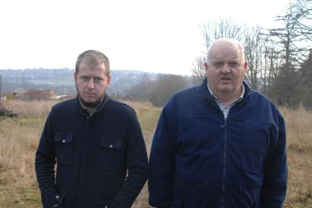 Hopeful travellers' site developers, Aaron Smith (right) and son Benjamin on the plot of land off Churchfield Drive, Rainworth.