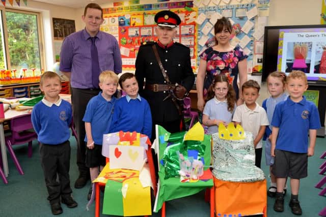Children at Heatherley Primary school had a visit from Deputy Lieutenant and former sheriff, Mr Michael Rowen as they celebrated the Queenâ¬"s 90th Birthday with a day of activities, pictured with Mr Rowen are teachers Lee Harrison and Stefanie Hanson