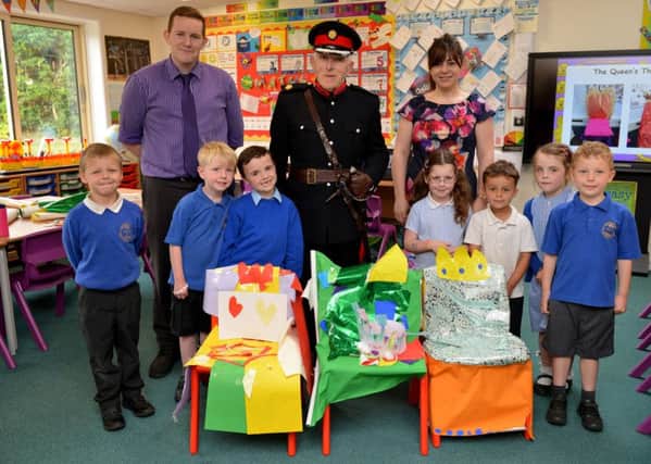 Children at Heatherley Primary school had a visit from Deputy Lieutenant and former sheriff, Mr Michael Rowen as they celebrated the QueenÃ¢Â¬"s 90th Birthday with a day of activities, pictured with Mr Rowen are teachers Lee Harrison and Stefanie Hanson