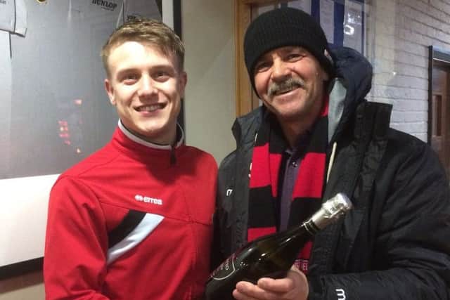 Nick Guest receives his man-of-the-match award from boss Rudy Funk.