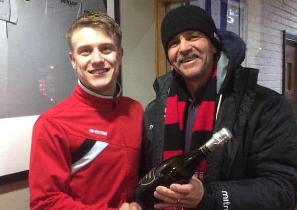 Nick Guest receives his man-of-the-match award from boss Rudy Funk.