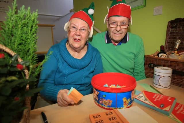 Christmas Fair at The Tin Hat Centre in Selston. Pictured are Jackie and Lawrie England on the raffle stall.